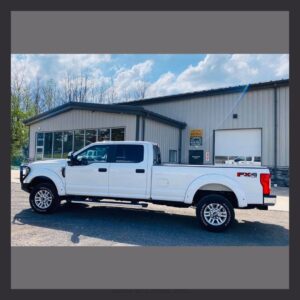 Ford-Super-Duty-color matched flares, LED lighting, and a large Road Armor Bumpers